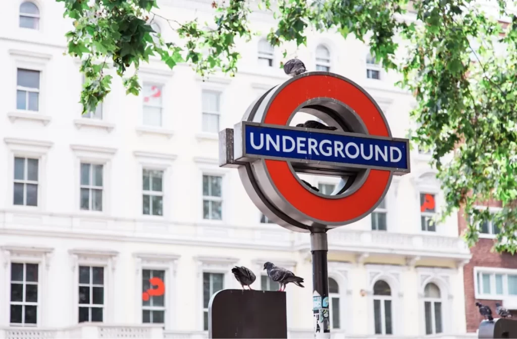 Underground sign in Inner-London near a building.