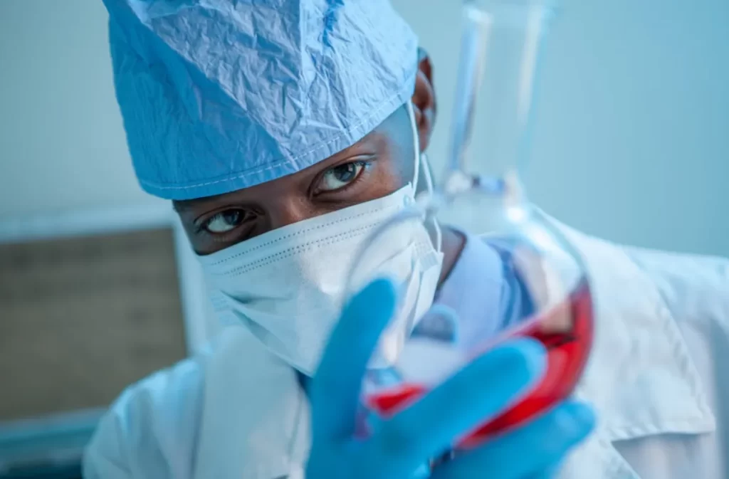 A doctor analyzing a sample for integrative health insights.