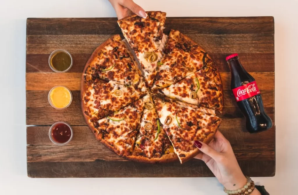 Sharing a pizza and soda for Pizza Night.