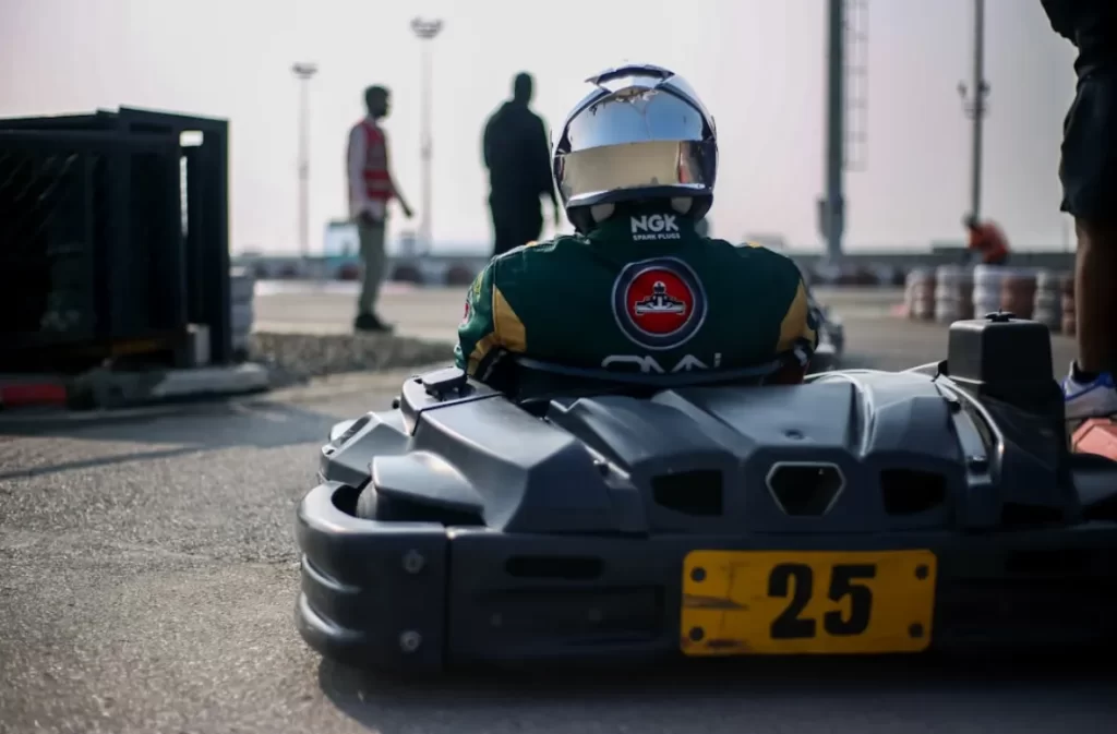 Driver sitting in go-kart waiting for race start.