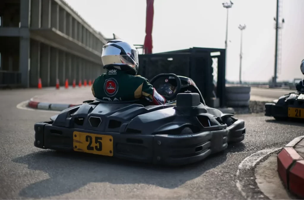 Indoor kart racer ready for action on the track.