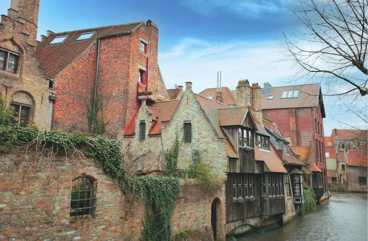 Brick buildings by a canal in Belgium.