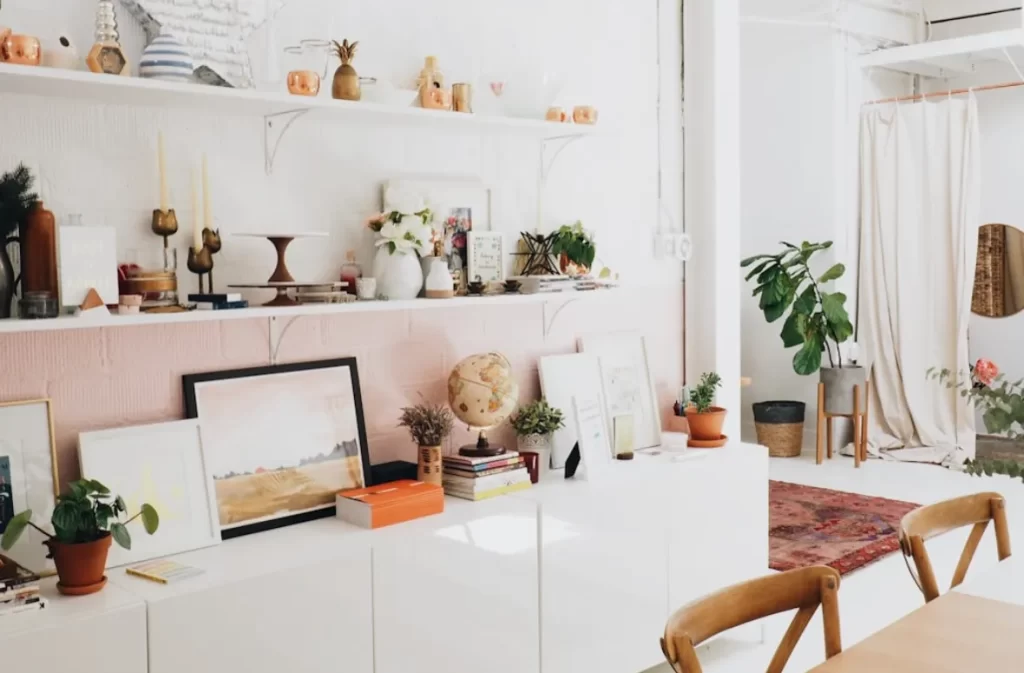 A stylish interior with plants and decorative items on shelves.