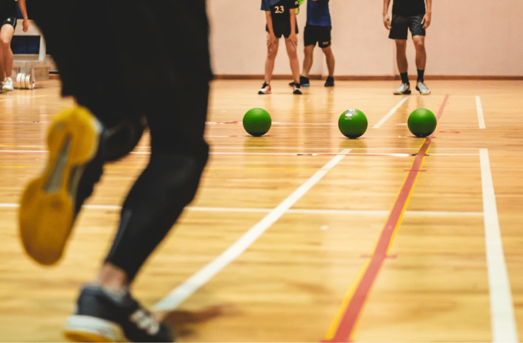 Players preparing for a dodgeball game.
