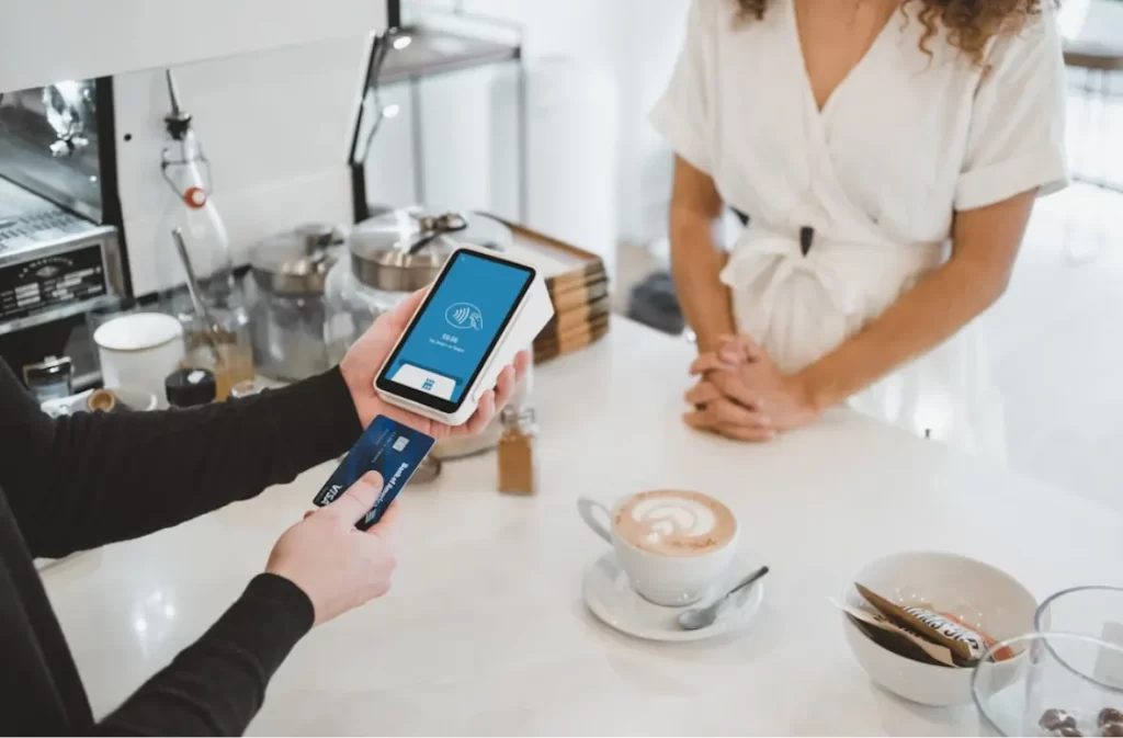 Mobile card payment at a coffee shop with Venmo limit consideration.