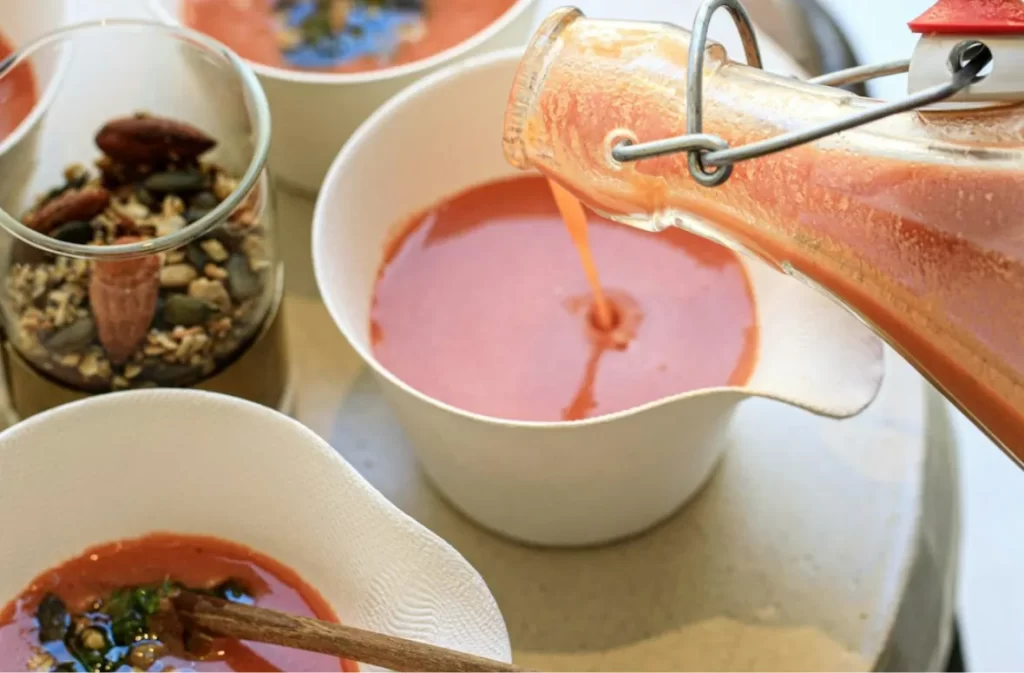 Fresh soup being poured by local catering service.
