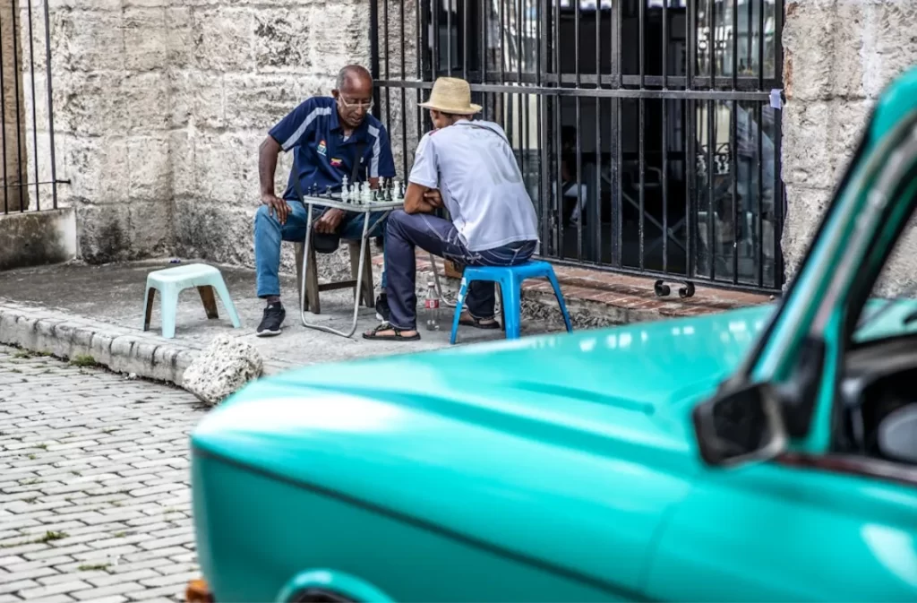 Playing chess on a street in a foreign city.