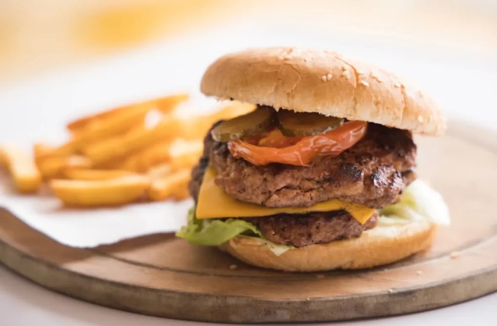 Cheeseburger and fries for a calories burn challenge.