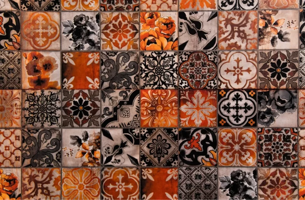 Vintage floral carpet tiles with a mix of orange and black.
