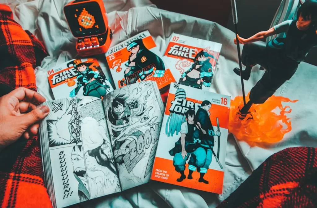 Fire Force manga collection displayed with a figurine.