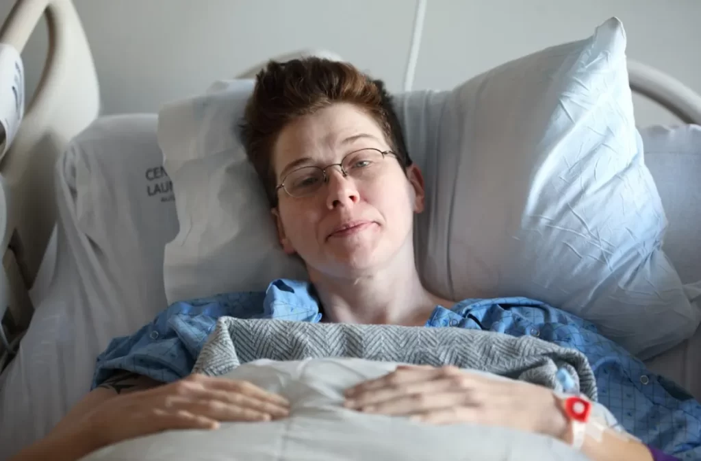 Patient lying in a hospital bed.