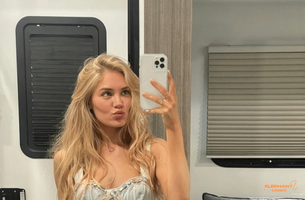 Michelle Randolph taking a selfie in a casual outfit, pouting.