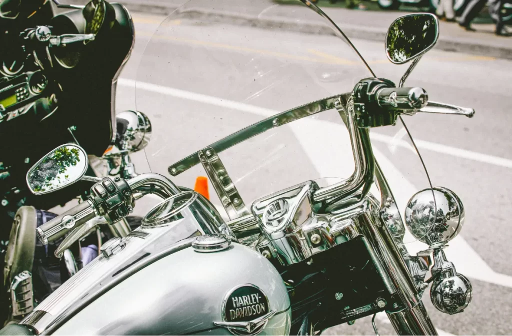 Close-up of Harley-Davidson handlebars and chrome details.